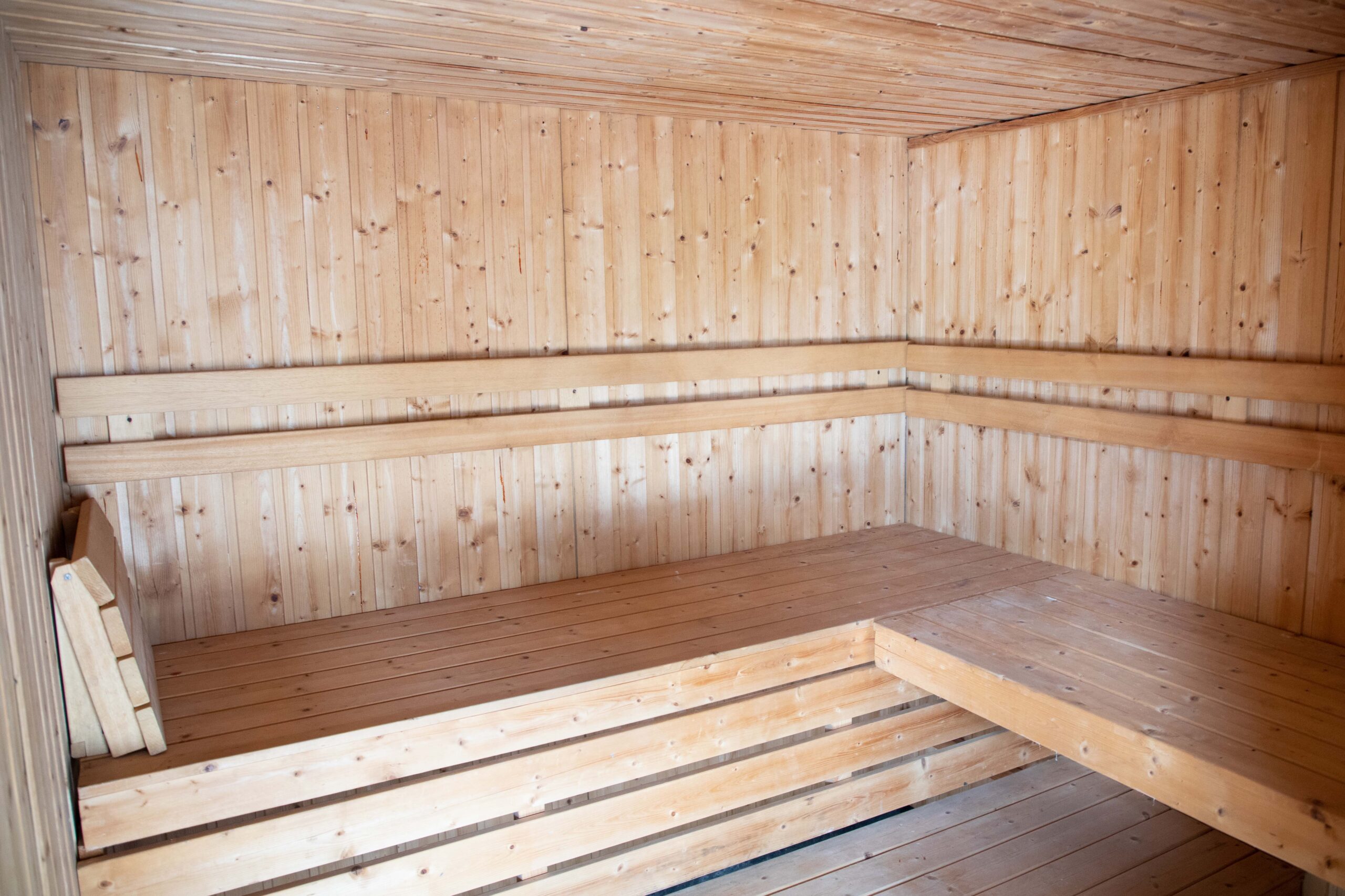 Interior view of the sauna at Rock Spring Resort showing wooden benches and warm, inviting space for relaxation